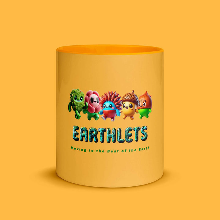 Earthlets mug with colorful interior featuring cute characters and text 'Moving to the Beat of the Earth'.