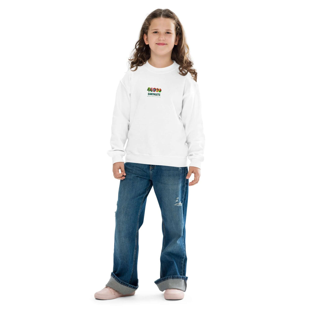 Youth model wearing a white Earthlets crewneck sweatshirt, paired with blue jeans and casual shoes, showcasing a cozy fit.